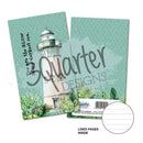 Notebook with lighthouse design and 'Quarter Designs' branding on a white background