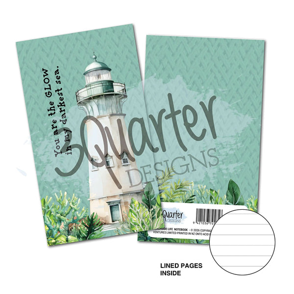 Notebook with lighthouse design and 'Quarter Designs' branding on a white background