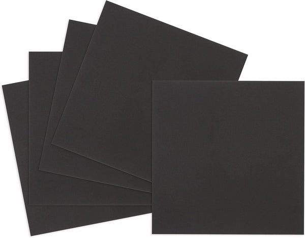 Five sheets of black paper on a white background