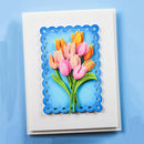 Greeting card with colorful tulips design on a blue background