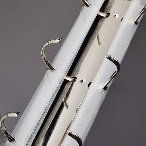 Close-up of a white bicycle frame with silver components on a gray background