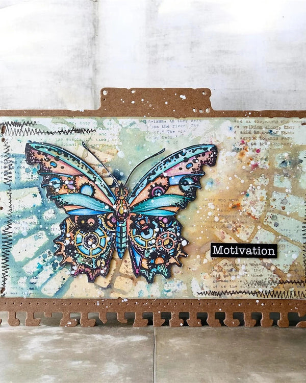 Notebook with a decorative butterfly cover on a textured surface