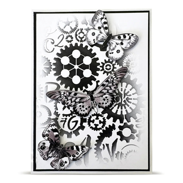Decorative wall art with black and white butterflies and gears on a white background