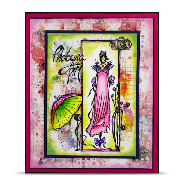 Colorful art card with a stylized illustration of a woman in a pink dress, holding a yellow umbrella, on a textured background.