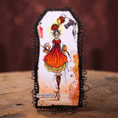 Decorative card with a stylized illustration of a woman in a red dress on a wooden surface.