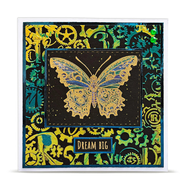Decorative card with a gold butterfly design and 'Dream Big' text on a colorful patterned background.