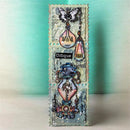 Decorative bookmark with artistic designs and text on a gradient background