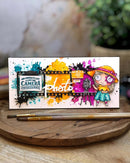 Colorful card with a camera-themed design on a wooden surface