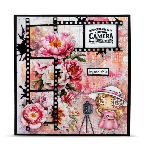 Decorative card with floral design, vintage camera, and cartoon girl in a pink dress.