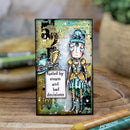 Artistic card with a character and text 'fueled by steam and bad decisions' on a wooden surface.
