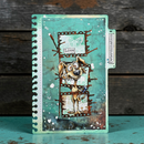 Notebook with a decorative cover featuring a cartoon dog and text on a wooden surface