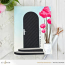 Greeting card with a black door and pink flowers on a white background, featuring the brand 'Altenew'.
