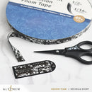 Altenew foam tape with floral design, scissors, and packaging on a marble surface.