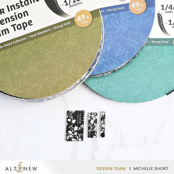 Three rolls of floral-patterned tape with a small roll of black and white patterned tape on a white background, featuring the Altenew brand.