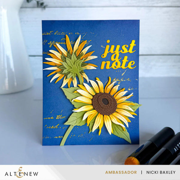 Card with sunflower design and 'just note' text on a blue background, featuring Altenew branding.
