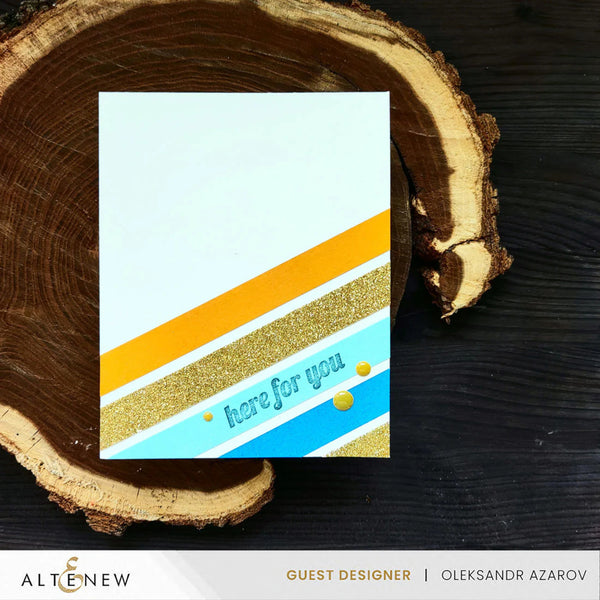 Card with striped design and 'here for you' text on a wooden surface, featuring the brand 'Altenew'.