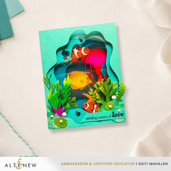 Colorful card with ocean-themed design featuring fish and jellyfish, on a light background.