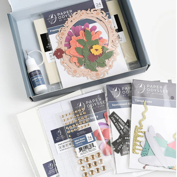 Crafting kit with floral design and supplies from Paper Odyssey on a white background