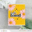 Greeting card with pink daisies and 'hello friend' text on a yellow background, featuring the brand 'Altenew'.