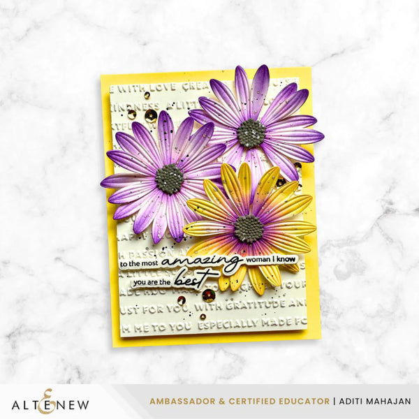 Card with purple and yellow flowers and text on a marble background, featuring the brand 'Altenew'.