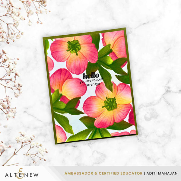 Floral card with pink flowers and green leaves on a white marble background, featuring the brand 'Altenew'.