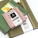 Set of watercolor sketchbooks with visible brand label on a white background