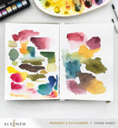 Open book with watercolor swatches on a white surface, with 'Altenew' branding visible.