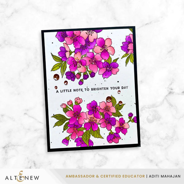 Card with floral design and text on a white marble background, featuring the brand 'Altenew'.