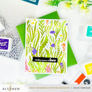 Card with ocean-themed design and green envelope on a white background