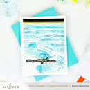 Greeting card with ocean wave design and text 'wishing you comfort and calm' on a white background with teal envelope.