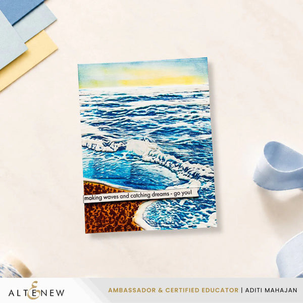 Card with ocean design and text on a light surface, featuring the brand 'Altenew'.