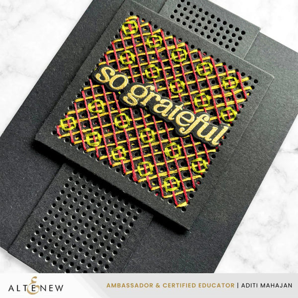 Black card with yellow and red text 'go grateful' on a white background