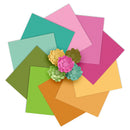 Colorful paper squares with floral decorations on a white background