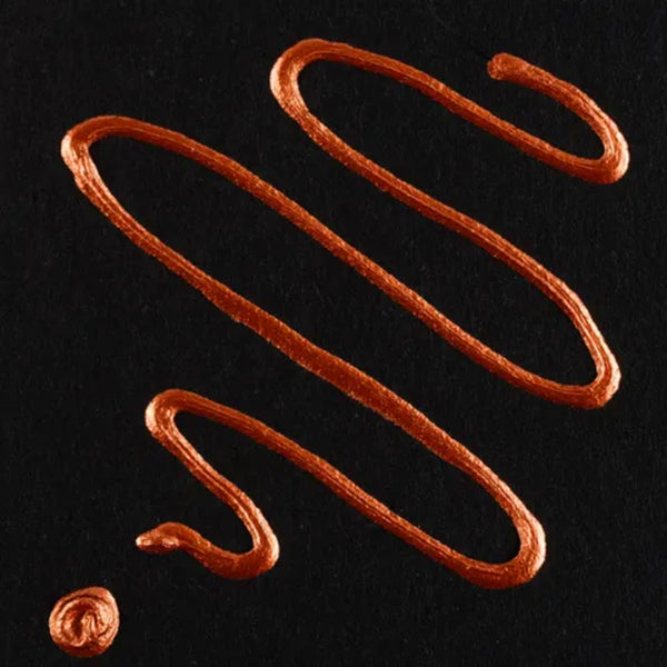 Brown sauce drizzle on a black background
