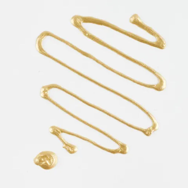Gold-colored metal hair clip on a white background