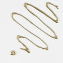 Gold paint swatch on a white background