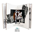 Black and white illustration of a couple dancing with leafy decorations on a white background