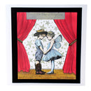 Illustration of a cowboy and fairy holding hands on a stage with red curtains and star patterned wall.