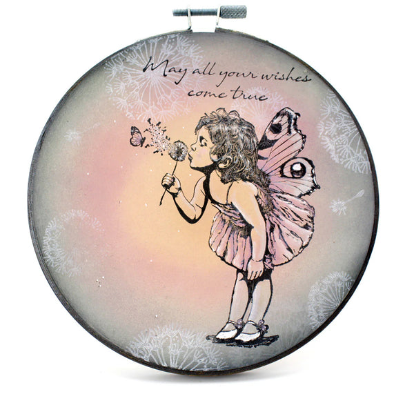 Round pouch with fairy illustration and text 'May all your wishes come true' on a white background