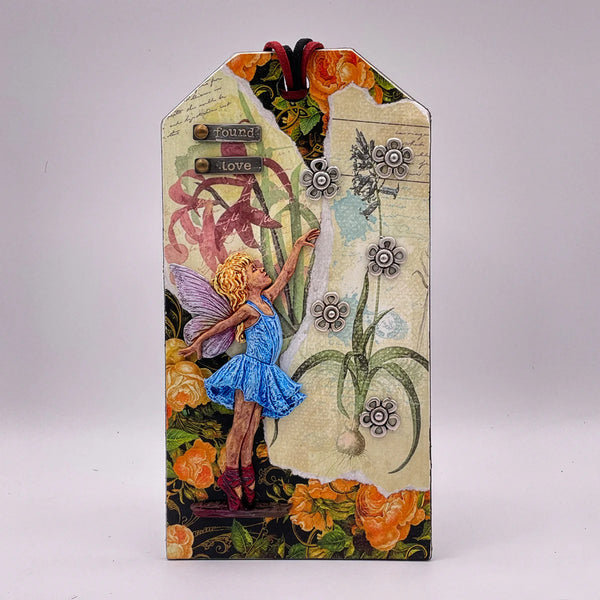 Decorative card with fairy and floral design on a white background