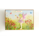 Fairy in a garden with flowers and butterflies, featuring the word 'Dream'.