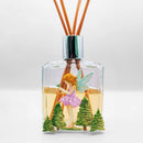 Fragrance diffuser with fairy design on a white background