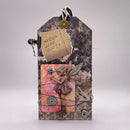 Decorative tag with fairy design and 'Faries Wear Boots' text on a textured background