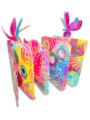 Colorful butterfly-themed notebooks with decorative ribbons on a white background