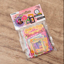 Packaged colorful paper frames on a wooden surface