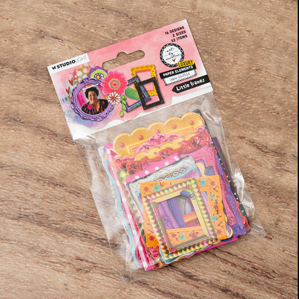 Packaged colorful paper frames on a wooden surface