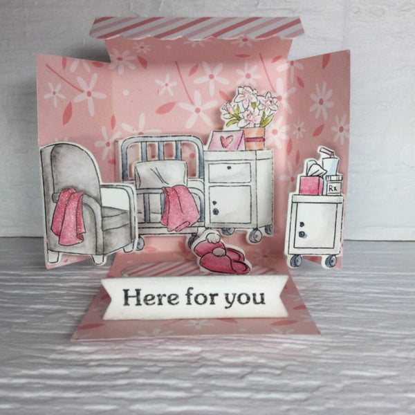 Card with hospital room illustration and 'Here for you' text on a floral background