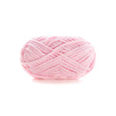 Pink yarn ball on a white background