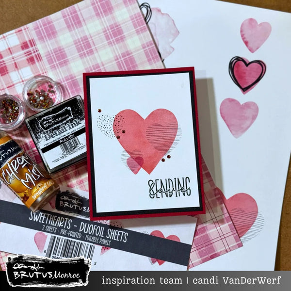 Card with heart design and craft supplies on a table
