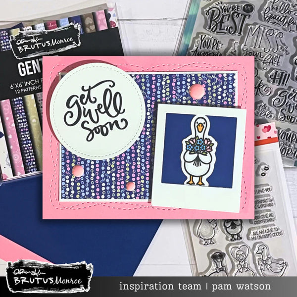 Card with 'Get Well Soon' message and duck illustration, surrounded by stamping supplies.